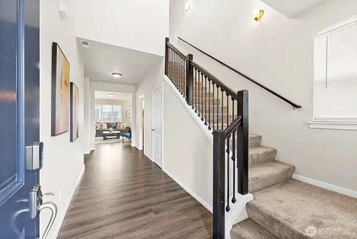 Wide open hallway leads to the heart of the home.