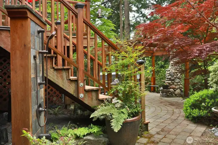 Outdoor shower and path to outdoor patio.