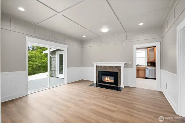 New interior paint, updated flooring & propane fireplace. Slider doors out to new trex deck!