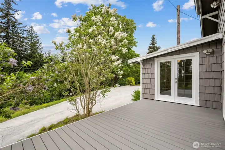 Brand new trex decking surrounds home.