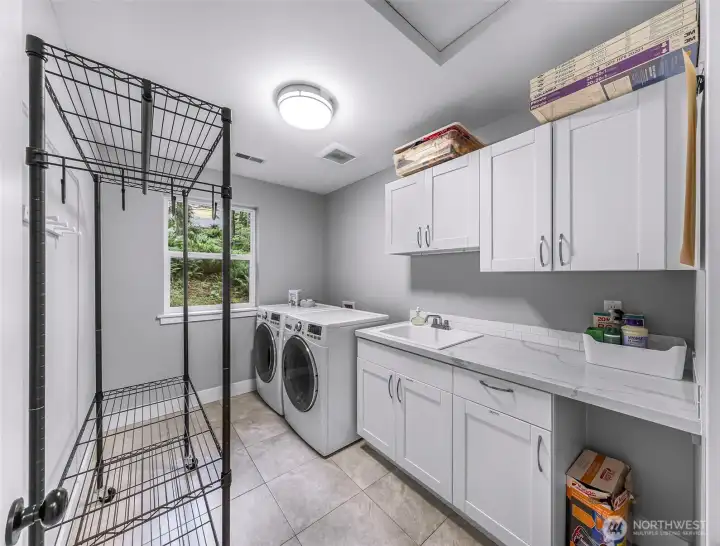 Generous laundry room w/ storage and utility sink-- on the second floor where you actually generate laundry! Generous laundry room w/ storage and utility sink-- on the second floor where you actually generate laundry!
