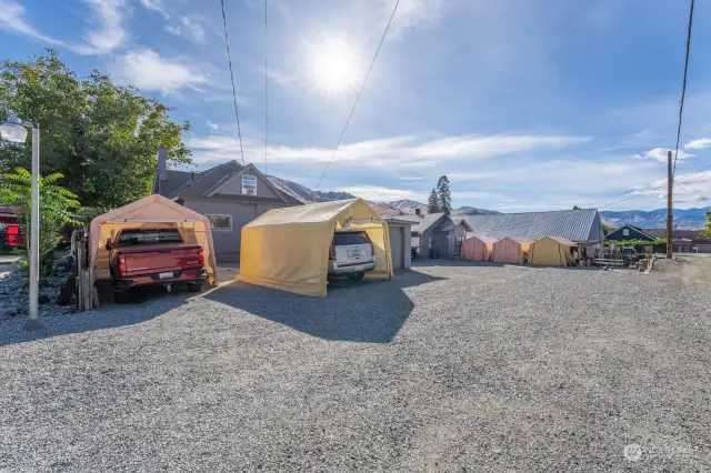 Ample parking, gravel driveway, with alley access.