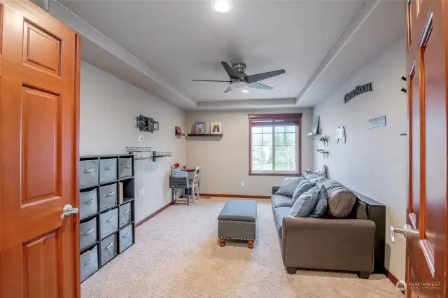 Entertainment room upstairs with doors for private enjoyment