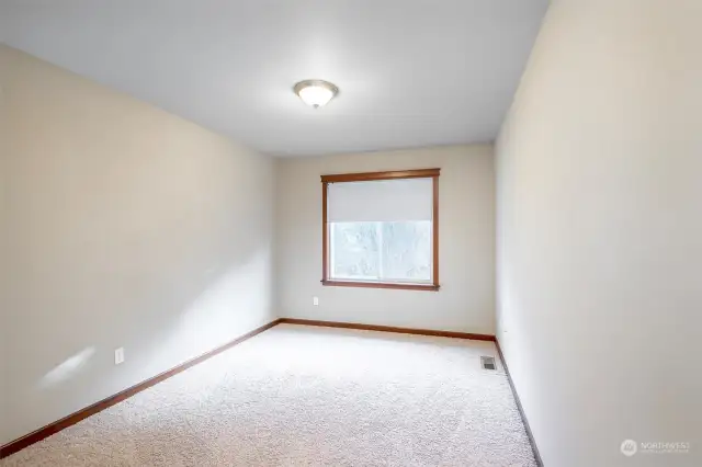 2 identical bedrooms flanking the laundry room