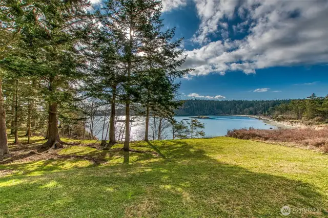 Sunny southern views across Aleck Bay from gently sloping acreage on Lopez Island.