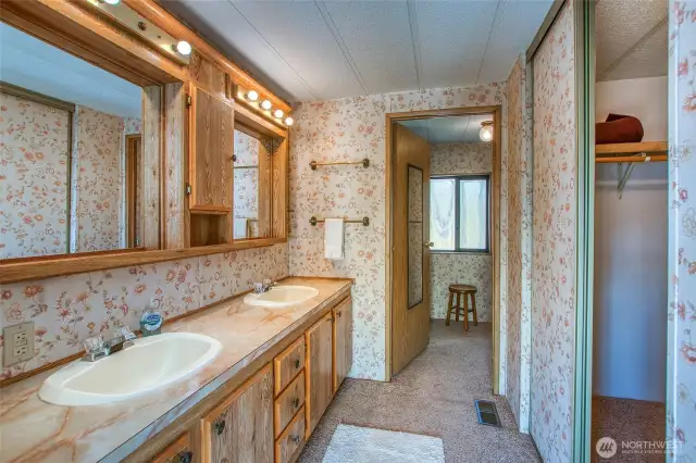 Primary ensuite bath with double vanity.