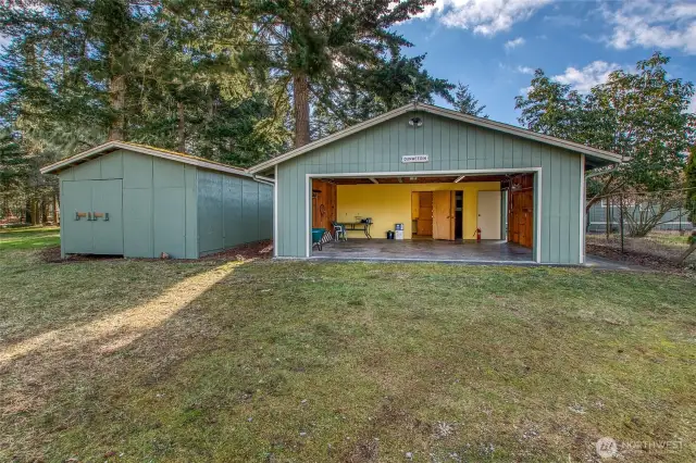 Detached two car garage with insulated shop and to the left a boat barn.