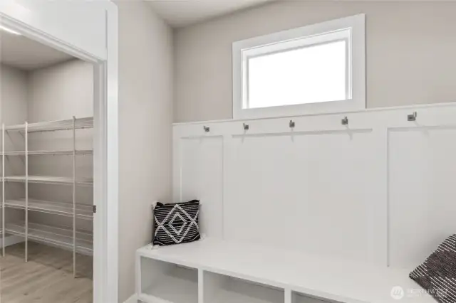 Built-in Shoe Drop & massive walk-in pantry are located as you enter from 3-Car Garage. Photos are for representational purposes only.  Colors and options may vary.