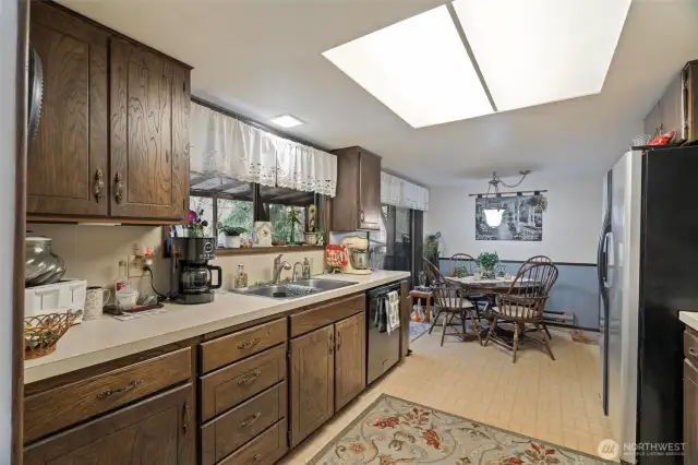 Enjoy the warm welcoming feeling of this large open galley kitchen. Watch the families of deer wander through your back yard from the kitchen windows.