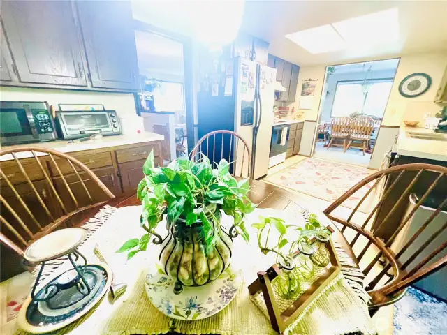 Cozy breakfast nook with extra kitchen storage.