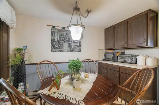Cozy breakfast nook with extra kitchen storage.