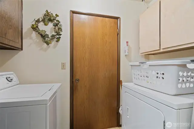 Laundry facilities area in downstairs bathroom.