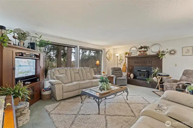 Upstairs on the main level, enter into a large cozy living space, perfect for relaxing or entertaining.