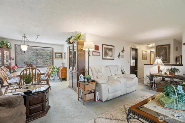 The large dining room leads into a clean and bright galley kitchen with breakfast nook.