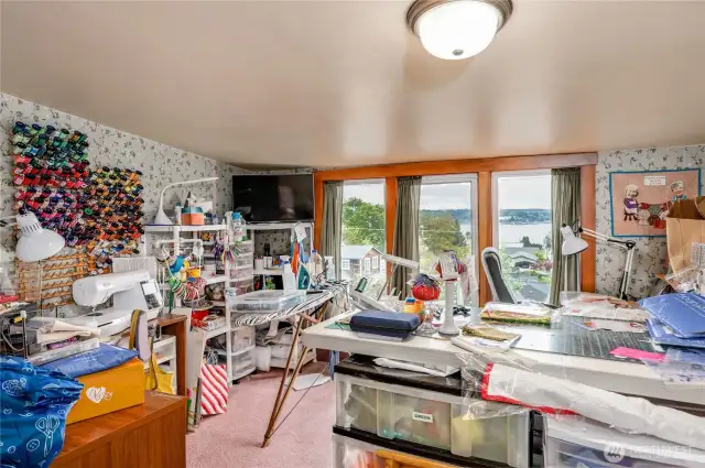 The 2nd bedroom is being used as a sewing room.