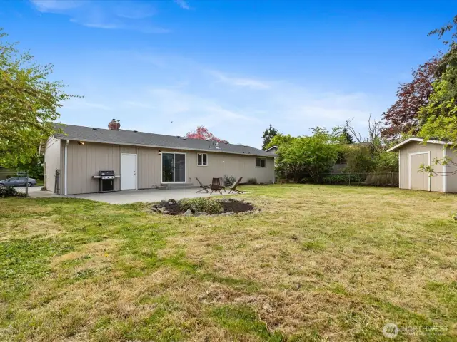 Nice sized back yard with large patio off the slider and a large storage shed.