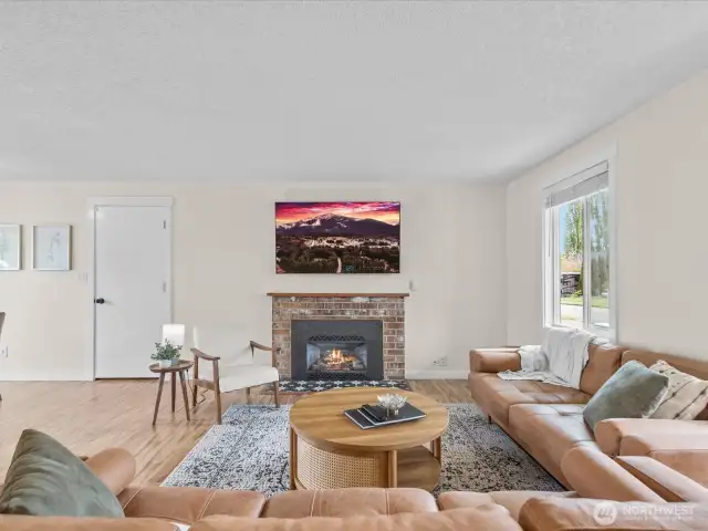 Spacious living room - door to attached garage, fireplace