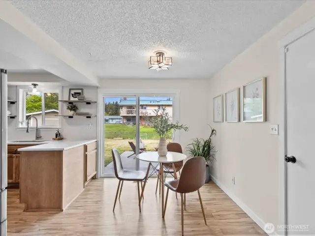 Dining area off the kitchen with slider to the backyard