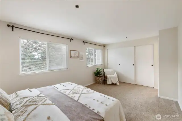 The primary bedroom has plenty of natural light and a large closet.