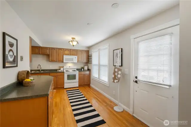Your large kitchen has plenty of counter space, real hardwood floors, fresh paint, and appliances that stay.