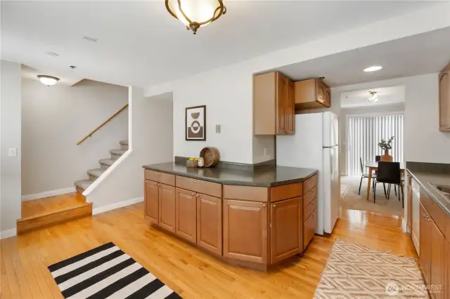 A view from the kitchen into the dining area and up the stairs to the bedrooms. Wouldn't that counter make a great coffee bar?