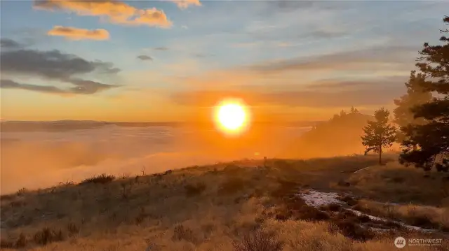 Mist crashes against the cliffs like waves.