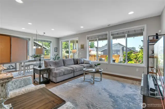 Living Room bathed in natural light. Sliding door exits to back yard with greenbelt (and winter peeks at Mt. Rainier) to the southeast.
