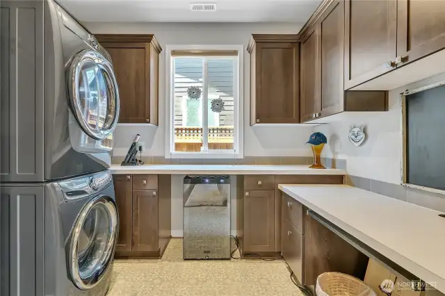 Laundry Room and More! Built-in Desk area and abundant storage. Hobby Room, flex space, wine fridge..., the possibilities are endless.