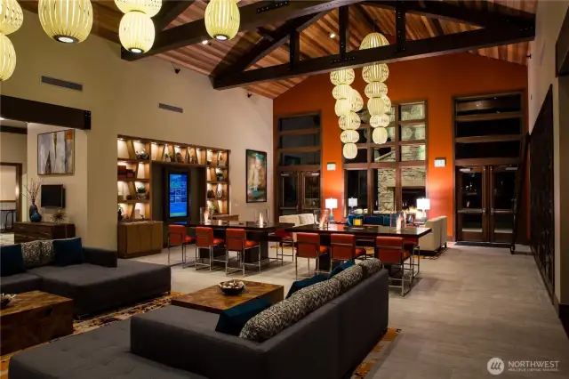 The Seven Summits Lodge Grand Living Room! Digital display with upcoming events, comfy seating to socialize and catch up with friends, and wine storage lockers.
