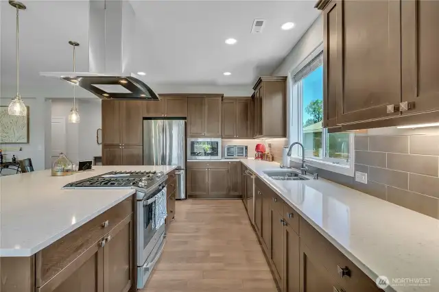 Home Chefs delight! This Kitchen offers matching stainless appliances with gas cooktop, under-cabinet lighting, built in microwave, and plenty of prep space.
