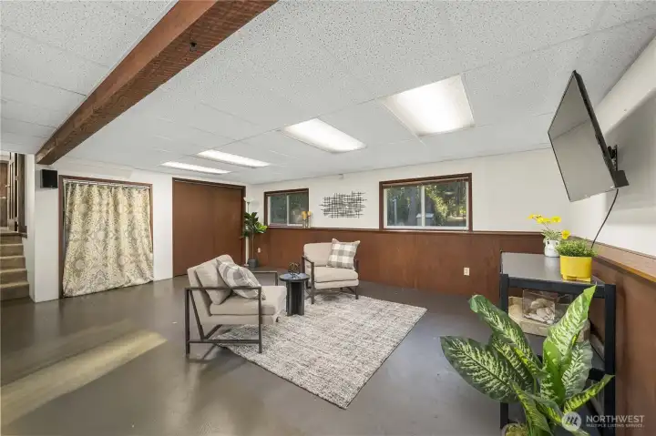Large recreational room has 2 storage closets and surround speakers