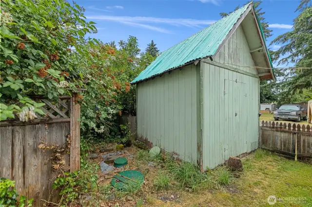Large storage shed behind the house