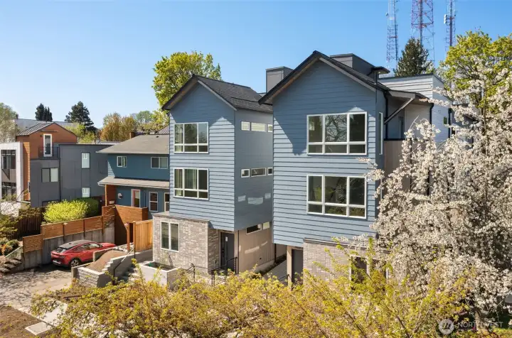 Welcome to the Capitol Pines Collection — where sleek modern design meets timeless Northwest charm. These striking homes make a statement from the curb with bold symmetry, crisp lines, and a central walkway that sets the tone for something unique.