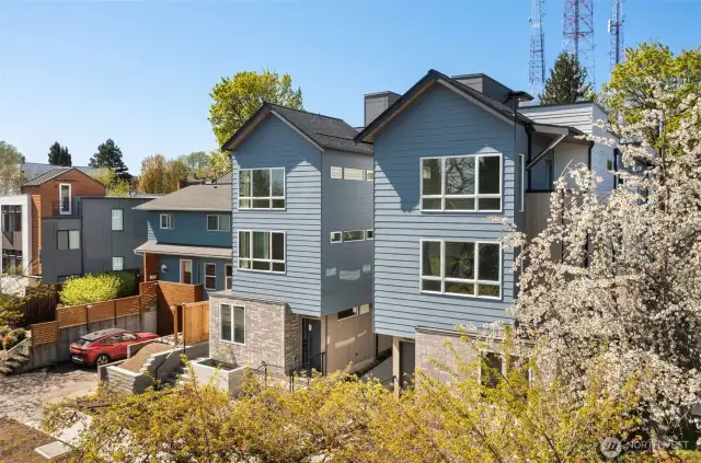 Welcome to the Capitol Pines Collection — where sleek modern design meets timeless Northwest charm. These striking homes make a statement from the curb with bold symmetry, crisp lines, and a central walkway that sets the tone for something unique.
