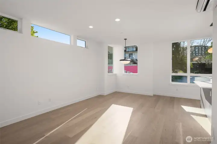 Sun-soaked living and dining flow into a beautifully finished kitchen, where form meets function in every detail.