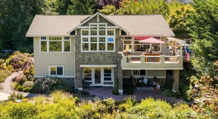 Stunning exterior with cedar shingles & great outdoor hangout spots!