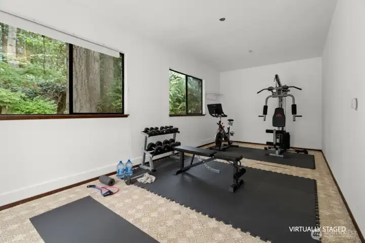 This studio is attached to the garage and is shown here virtually staged.
