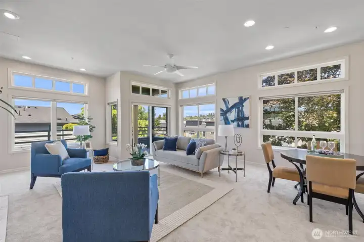 Large living room, with 10 foot ceilings and deck.