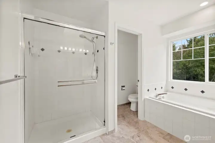 Primary bathroom is also very roomy, light and bright.