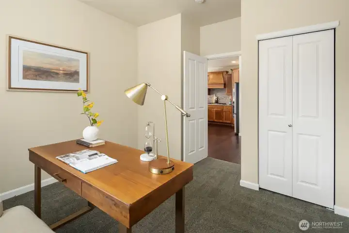 Main floor office/bedroom/flex space, across the hall from powder room with shower.