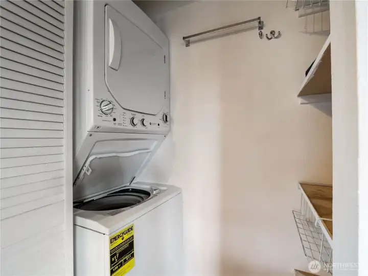Washer dryer behind the louvered doors.