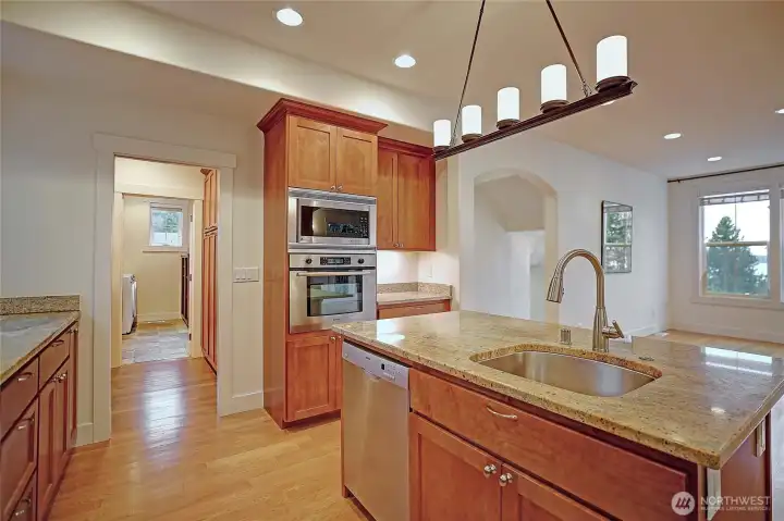 The Kitchen is open to to dining room. The doorway straight ahead leads into the butlers pantry & laundry room.