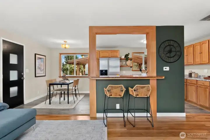 Breakfast bar overlooks kitchen area.