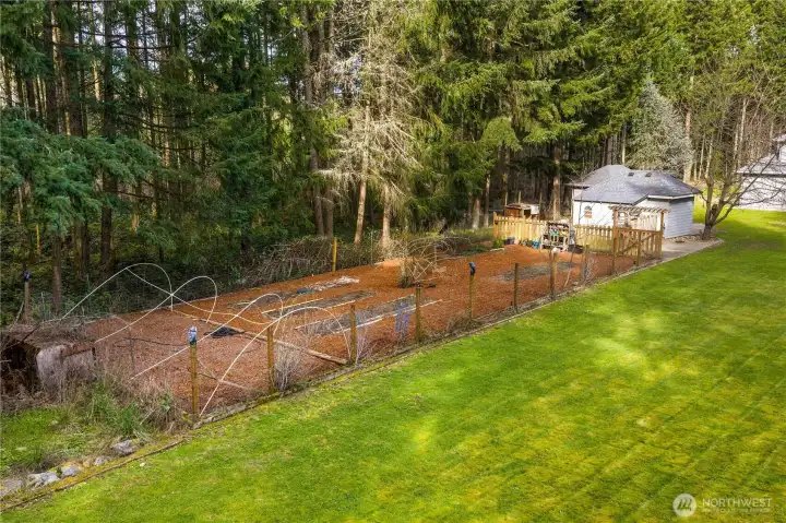 fenced and raised garden bed