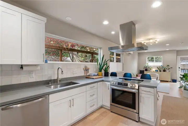 Stainless steel appliances, quartz countertops, and plenty of cabinet space.