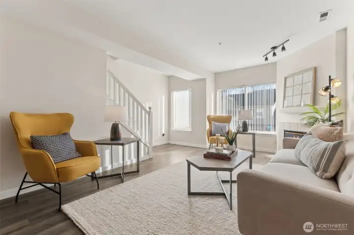 Looking towards the windows and staircase to the upper level.