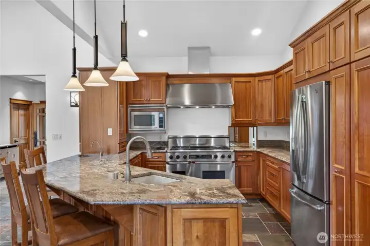 Well appointed kitchen with custom cherry cabinets