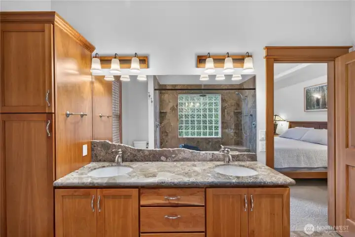 Notice the live-edge stone finishes above the double sinks