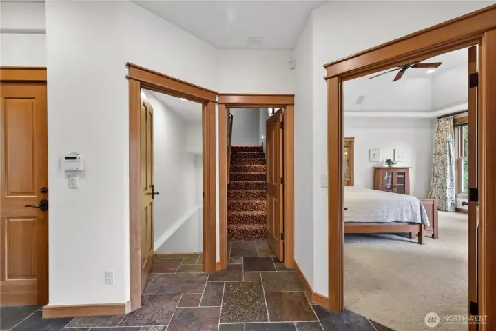 Stairs to home theater located above the attached garage.