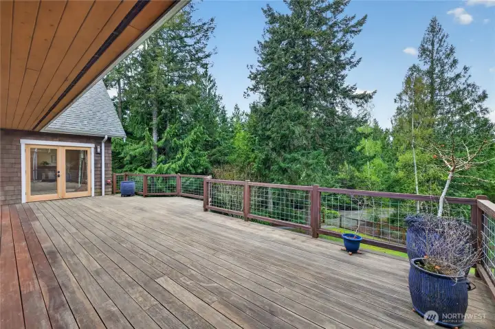 Over sized deck made of Epay Brazilian wood. Stairs to the right lead to lower patio